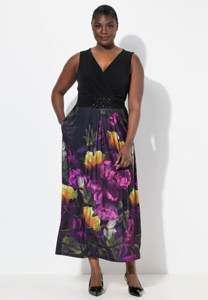 Maxime vestidos con un cuerpo envuelto negro y una falda de estampado floral que presenta flores en colores púrpura, amarillo y blanco; cinturilla detallada con acentos.