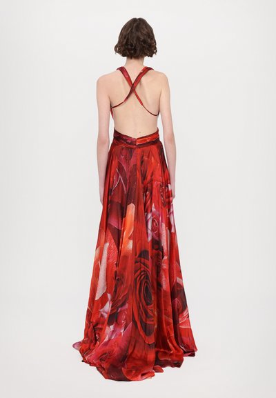 Red floral maxi dress with a crisscross back and a flowing skirt, featuring a satin finish and rose print throughout.