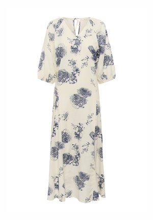 Floral knee-length dress featuring a lightweight, beige fabric with blue flower patterns, a v-neckline, and puffed sleeves.