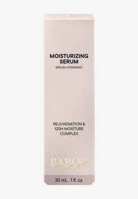 Boîte beige clair avec texte bleu foncé. L'étiquette avant indique "Sérum Hydratant", contenant des détails sur "Rajeunissement & Complexe d'Hydratation 120H."