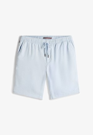 Light blue cotton shorts with an elastic waistband, drawstring, and two side pockets. Smooth texture and a relaxed fit design.