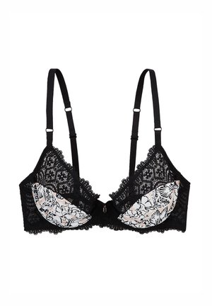 Soutien-gorge en dentelle noire avec des bonnets en mousse à motif floral, bretelles réglables, bords festonnés et un détail en nœud au centre.
