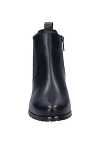 Black leather ankle boot featuring a smooth finish, textured side panel, and a side zipper. Includes a pull tab for easy wear.