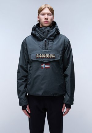 Dark green lightweight jacket with a high collar, zippered front, large horizontal logo patch, and small Norwegian flag detail.