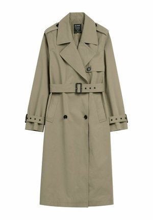 Beżowy długi płaszcz trencz z szerokimi klapami, paskiem w talii, zapinanymi na guziki mankietami oraz podwójnym rzędem czarnych guzików.