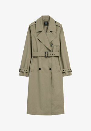 Beżowy długi płaszcz trencz z szerokimi klapami, paskiem w talii, zapinanymi na guziki mankietami oraz podwójnym rzędem czarnych guzików.