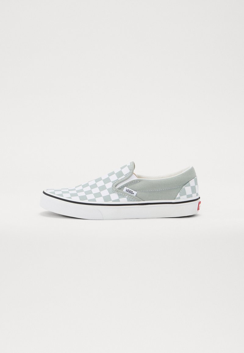 Slip-on sneakers with a green and white checkerboard pattern, suede accents, elastic side panels, and a white rubber sole with black trim.