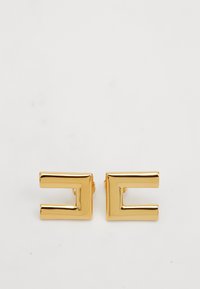 Pair of shiny gold rectangular open hoop earrings with a modern, geometric design on a white background.