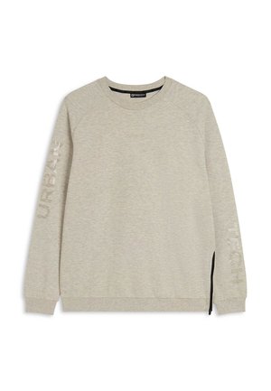 Sweat-shirt gris clair avec des manches raglan. Présente des zips sur les côtés et le mot « URBAN » imprimé verticalement sur la manche gauche. Texture lisse.