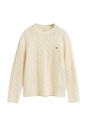 Pull en maille torsadée crème avec un col rond, des poignets et un ourlet avec côtes. Présente un subtil logo brodé sur la poitrine. Tissu doux et texturé.