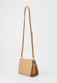 Tommy Hilfiger LEGACY MINI  - Taška s příčným popruhem - khaki