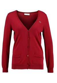 Red knitted cardigan with a V-neck, long sleeves, front pockets, and a small logo on the left side. Features button closure design.
