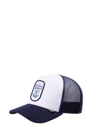 Gorra trucker en blanco y azul marino con malla trasera y un parche frontal que dice "Djinns Originales" con un diseño de olas y plantas.