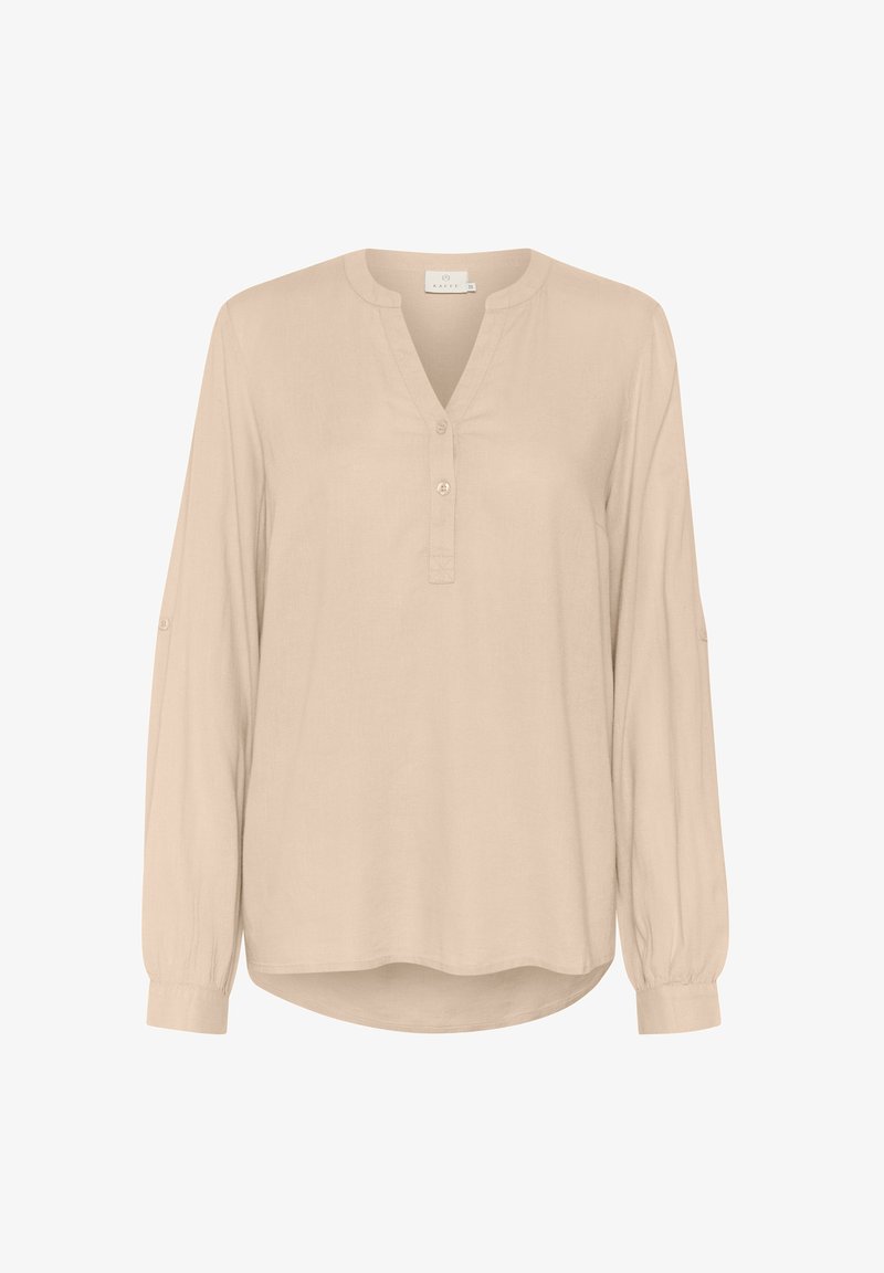 Világos bézs színű, hosszú ujjú blúz V-nyakkal és gombos záróval. Puha anyagból készült, felhajtott mandzsettákkal és ívelt hemmed.