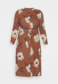Brun midi kjole med lange ærmer, stor cremefarvet blomsterprint, knaplukning foran, stand krave og taljebælte.