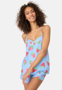 Light blue pajama set featuring strawberry print, with a sleeveless top and shorts, crafted from soft fabric, showcasing vibrant colors and patterns.