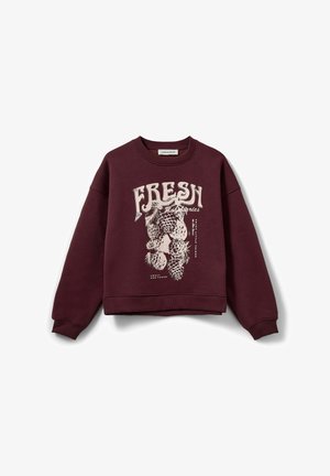 Burgundia värvi särk ümmarguse kaelusega, üle suurus, mille ees on valge ananasside graafika ja tekst "FRESH". Ribiga mansetid ja äär.