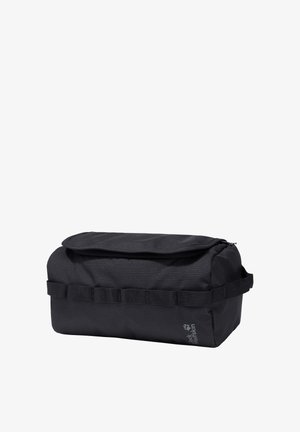 Zwarte rechthoekige toilettas met klep bovenop, zijhandvat, gestikte lussen en Jack Wolfskin-logo op de voorkant.