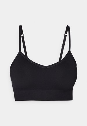 Black bra made of smooth fabric with a V-neckline, adjustable thin straps, and a wide band at the bottom. No padding or underwire.