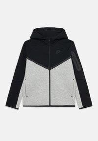 Nike hoodie in black and light gray. Features a zip closure, angled color blocking, and side pockets. Material appears soft and flexible.