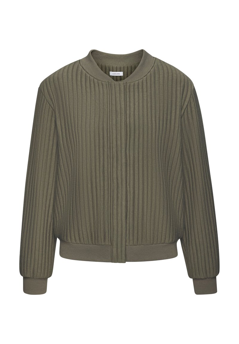 Olīvu zaļš, ribota auduma jaka ar apaļu kakla izgriezumu, priekšējo zīdīšanu un elastīgiem piedurkņu galiem. Izejā ir brīvs griezums un maiga tekstūra.