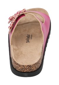 Pink slide sandal with a textured cork footbed, shiny strap adorned with a chain accent, and a rubber outsole for grip.