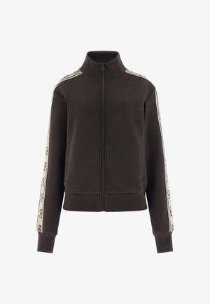 Czarna kurtka na zamek z wysokim kołnierzem, beżowe paski z logo na rękawach, ściągacze na mankietach i dole oraz dyskretne logo "GUESS" na piersi.