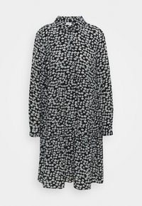 Abito nero con maniche lunghe, colletto, caratterizzato da un motivo floreale bianco. Vestibilità ampia con un design a strati e chiusura a bottoni.