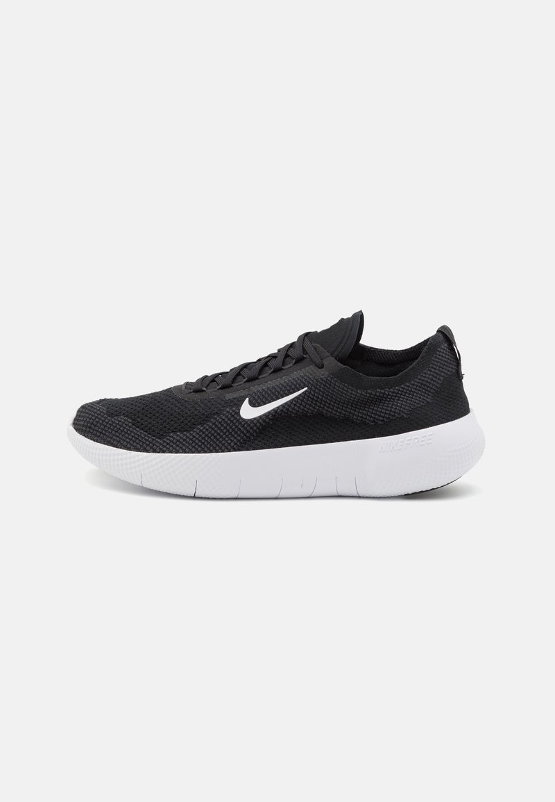 Sorte sportssko lavet af mesh og syntetisk materiale. Har et hvidt Nike swoosh og en kontrasterende hvid sål. Lavprofil design.
