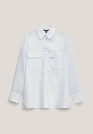White button-up shirt, long sleeves, soft fabric, two chest pockets, pointed collar, straight hem. Smooth texture, minimal design.