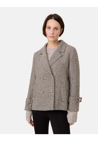 Doppelt geknöpfter Blazer im beigen und schwarzen Hahnentrittmuster, mit goldenen Knöpfen, breiten Revers und strukturierten Strickärmeln.