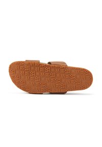 Brown slip-on sandal with a textured rubber sole, featuring an embossed pattern and dual straps for a secure fit.