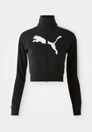 Giacca nera cropped con colletto alto, zip completa, strisce bianche laterali e grande logo Puma bianco sul davanti. Tessuto morbido e liscio.