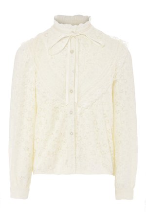 Cremefarvet bluse med lange ærmer, blondekant, høj krave, knapfront og sløjfede detalje. Lavet af tekstureret stof med blomstermønster.