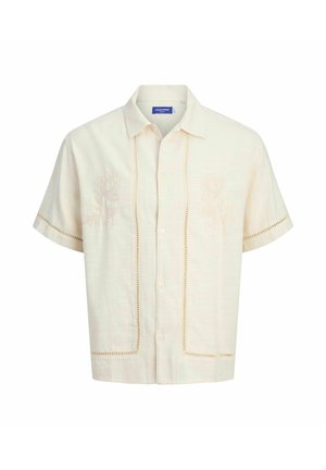 Kratka majica krem boje od lagane tkanine s cvjetnim vezom i nježnim izrezima duž rubova i prednjeg dijela s gumbima.