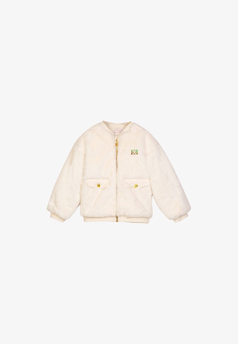 Crèmefarbener Kunstpelz-Jacke mit Reißverschluss, zwei Goldknopf-Taschen und Rundhalsausschnitt. Mit einem bestickten Logo auf der Brust.