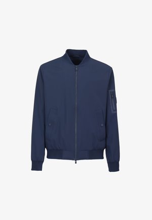 Blouson aviateur bleu marine avec fermeture éclair à l'avant, deux poches latérales à boutons-pression, poignets côtelés et une poche zippée sur la manche gauche.