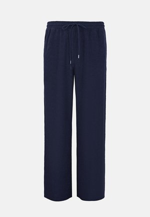 Marineblauwe, wijduitlopende broek gemaakt van geribd stof, met een elastische tailleband met trekkoord en zijzakken.