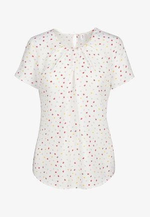 Biała bluzka z krótkim rękawem, okrągłym dekoltem z wycięciem w kształcie klucza, zdobiona rozproszonym drobnym wzorem serc w kolorach czerwonym, żółtym i szarym.