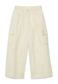 Ljusbeiga cargobyxor med elastisk midja, dragsko, sidofickor och sidocargofickor. Tillverkade av mjukt tyg med en avslappnad passform.