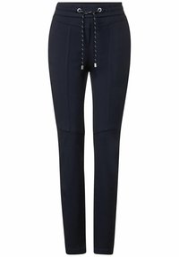 Marineblaue Jogginghosen mit einem Kordelzugbund, schmal zulaufenden Beinen und seitlichen Einsätzen. Hergestellt aus einem weichen, elastischen Material für höchsten Komfort.