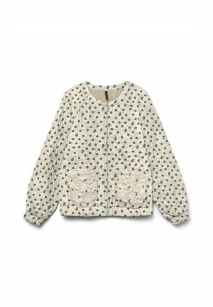 Quilted jacket in cream with navy floral pattern, round neck, zip closure, and two front pockets; features elasticized cuffs and hem.