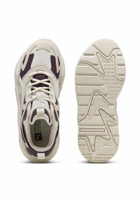 White and purple athletic shoes featuring a textured upper, lace-up design, and a patterned rubber sole for grip and durability.
