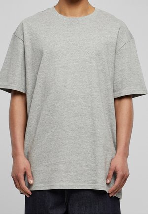 Grau Baumwoll-T-Shirt mit kurzen Ärmeln, Rundhalsausschnitt und lockerer Passform. Die Textur ist glatt, ohne Muster oder sichtbare Hardware.