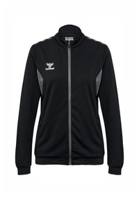 Schwarze Trainingsjacke mit Reißverschluss, hohem Kragen und grauen Akzenten an den Schultern. Sie verfügt über einen strukturierten Stoff und seitliche Taschen. Logo auf der Brust.
