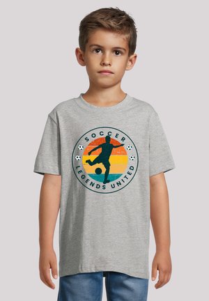 Gray short-sleeve T-shirt featuring a circular graphic with a soccer player, the text "SOCCER LEGENDS UNITED," and colorful sunset stripes.