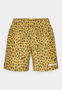 Leopard print šorcevi u žutoj boji s crnim točkama. Elastični pojas i bočni detalj s logotipom. Izrađeni od lagane, teksturirane tkanine.