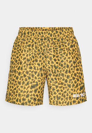 Leopard print šorcevi u žutoj boji s crnim točkama. Elastični pojas i bočni detalj s logotipom. Izrađeni od lagane, teksturirane tkanine.