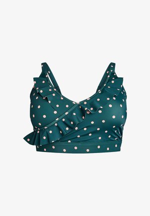 Turkizni modrček s roza pikami. Ima nabranine ob dekolteju in križno zasnovo. Narejen je iz gladkega, elastičnega materiala.