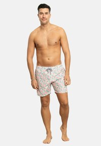 Bañador floral en rosa con detalles en azul y verde, que cuenta con una cinturilla elástica y cordón ajustable. Fabricado en un tejido ligero y de secado rápido.